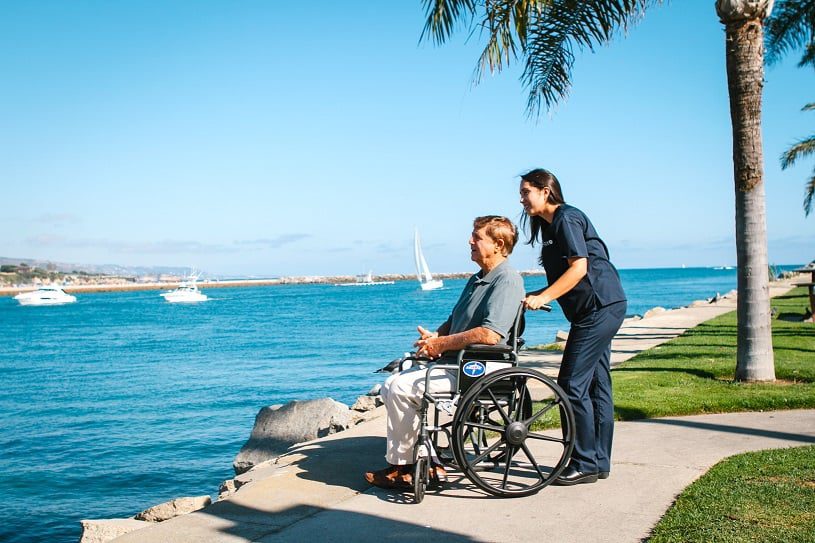 man in wheelchair at the ocean