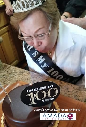An elderly woman celebrating her 100th birthday