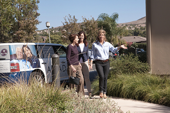 3 Amada caretakers giving family a tour